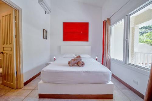 Ένα ή περισσότερα κρεβάτια σε δωμάτιο στο Villa Casa Azul & Arena Blanca Apartamentos