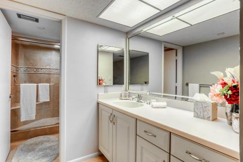 a bathroom with a sink and a mirror at Landmark Towers 203 in Clearwater Beach