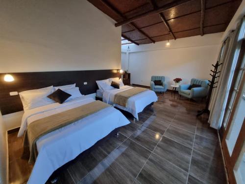 Ένα ή περισσότερα κρεβάτια σε δωμάτιο στο Wilppani Lodge