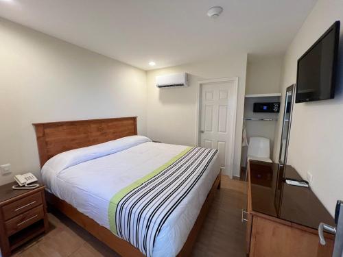 Postel nebo postele na pokoji v ubytování Hotel Baja