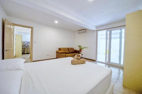 Ένα ή περισσότερα κρεβάτια σε δωμάτιο στο Villa Casa Azul & Arena Blanca Apartamentos
