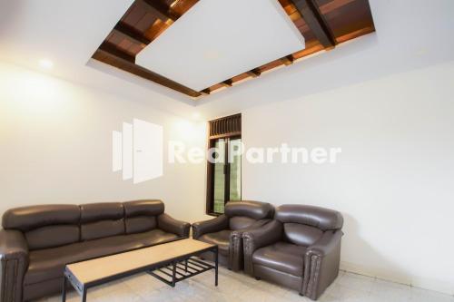 Χώρος καθιστικού στο Hatta Guest House Syariah near Hayam Wuruk Jelutung Mitra RedDoorz