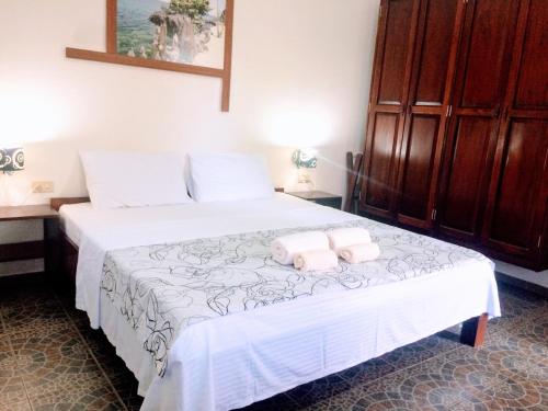 Postel nebo postele na pokoji v ubytování Meili Beach Resort