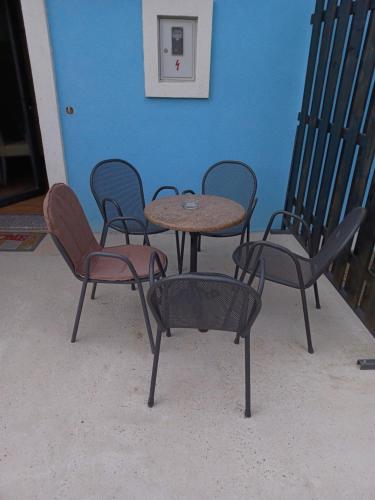 a group of chairs and a table in a room at Aquas AP in Petrijanec