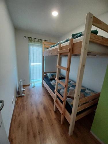 a bunk bed room with two bunk beds in it at Aquas AP in Petrijanec