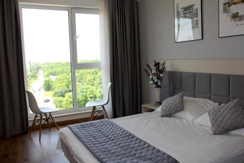 Cama ou camas em um quarto em Warsaw Apartments - Luxury Top-view Aparthotel