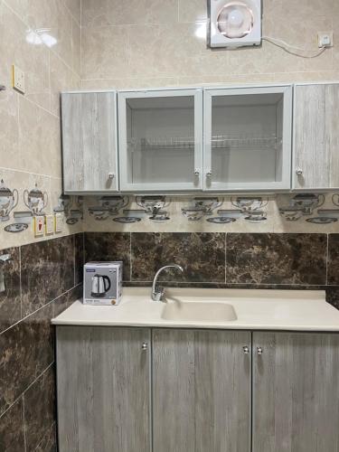 a kitchen with a sink and a counter top at سما2 in Yanbu