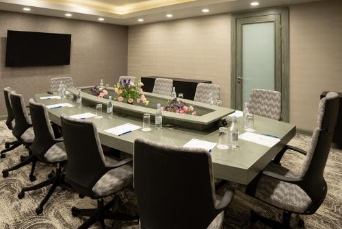 a conference room with a long table and chairs at Sphera by Stellar Hotels, Yerevan in Yerevan
