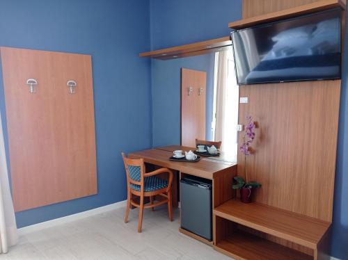 TV a/nebo společenská místnost v ubytování Hotel Verona