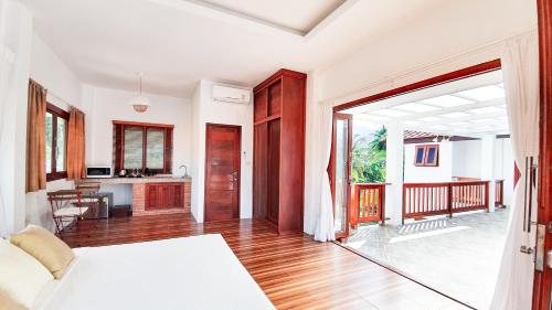 Postel nebo postele na pokoji v ubytování Baan Bhuwann Holiday Apartment