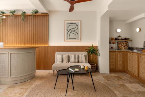 a living room with a couch and a table at Casa Natura in Rhodes Town