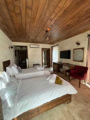 Postel nebo postele na pokoji v ubytování UCHI Cappadocia