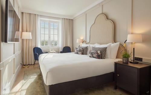 a hotel room with a large bed and a television at Hôtel Reisen in The Unbound Collection by Hyatt in Stockholm