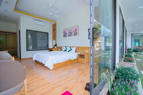 Postel nebo postele na pokoji v ubytování Cosy House - Venuestay