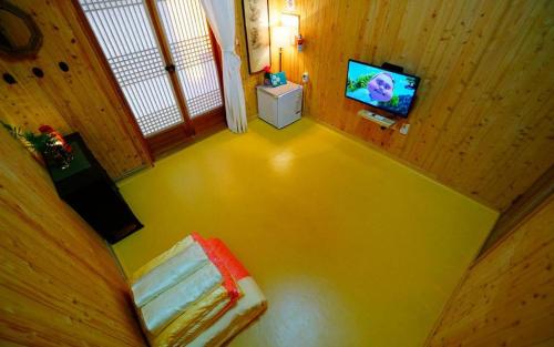 an overhead view of a room with a bed and a television at Full of Love Guesthouse in Jeonju
