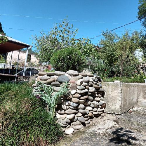a pile of rocks sitting next to a wall at Magdan house in Tskaltubo