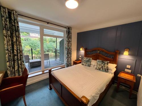 Ένα ή περισσότερα κρεβάτια σε δωμάτιο στο The Chainbridge Hotel