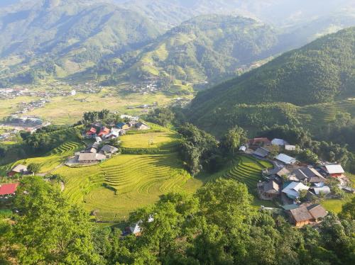 an aerial view of a village in the mountains at Má Si H'MÔNG HOMESTAY Tả Phìn in Sapa