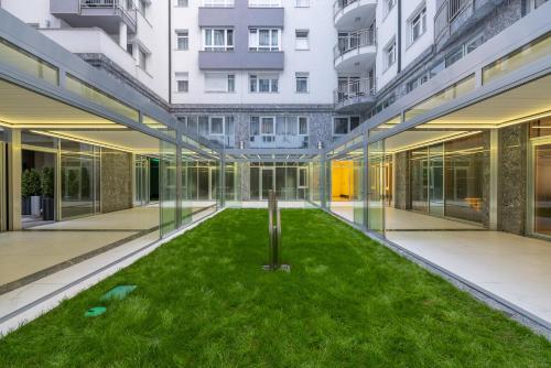 a courtyard with a cross in the middle of a building at Silver Crown Hotel & Residence, Palace Quarter in Budapest