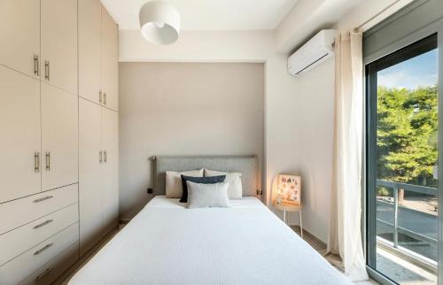 Postel nebo postele na pokoji v ubytování Eleusis Suites Β