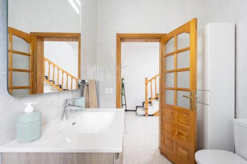 a bathroom with a sink and a mirror at Casa Maruca with Roque Nublo view in Tejeda