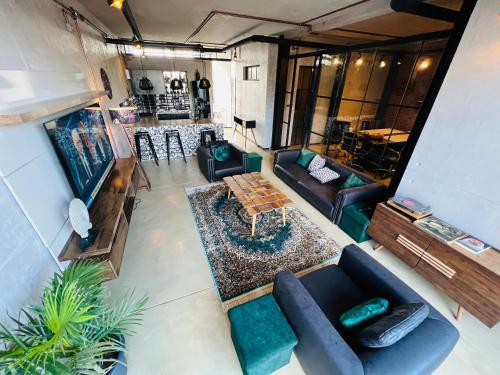 an overhead view of a living room with couches and a table at The Cubes in Lusaka