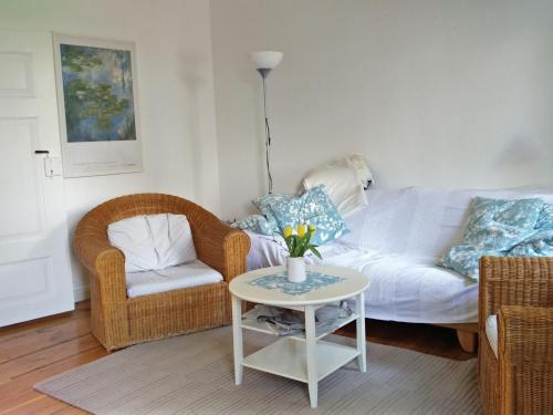 a living room with a couch and a table at Holiday Home Kranich by Interhome in Troja