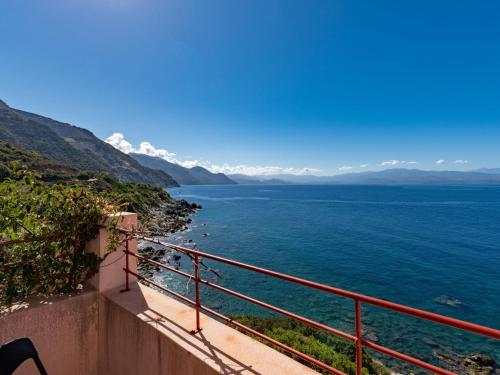 a view of the ocean from a balcony at Holiday Home Maison Balbi by Interhome in Canari