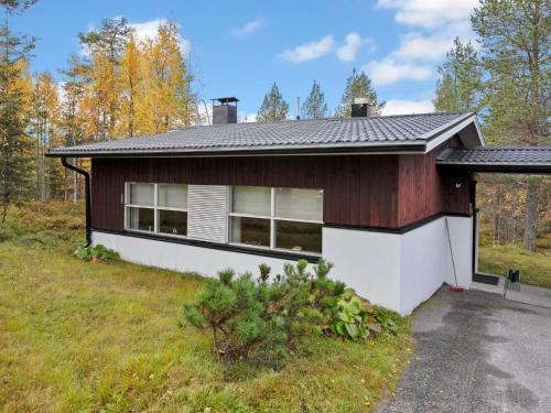 a house in the middle of a field at Holiday Home Valkeisrinne m1 by Interhome in Ruka