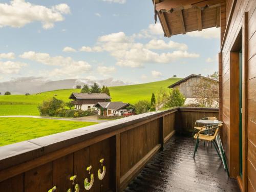 a balcony with a view of a green field at Apartment Fürstauer by Interhome in Saalfelden am Steinernen Meer