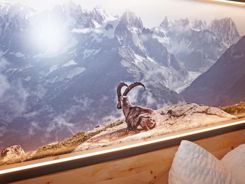 a painting of a goat on a mountain at Apartment Ladis-10 by Interhome in Ladis