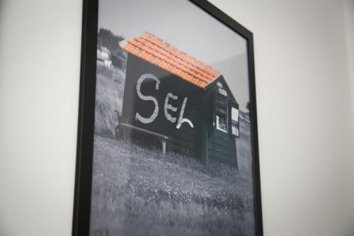 a picture of a black building with a roof at La Villa en L'île - 2 Piscines & Spa in Noirmoutier-en-l'lle