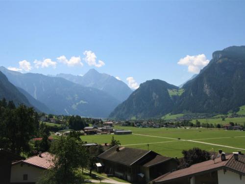 a village in a valley with mountains in the background at Apartment Geislerhof by Interhome in Ramsau