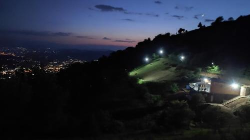 a house on a hill at night at Villa unforgettable in Sarajevo