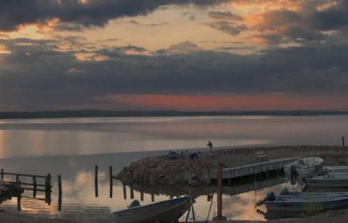 a group of boats docked at a dock on a lake at Norrö Holiday Village in Bamböle