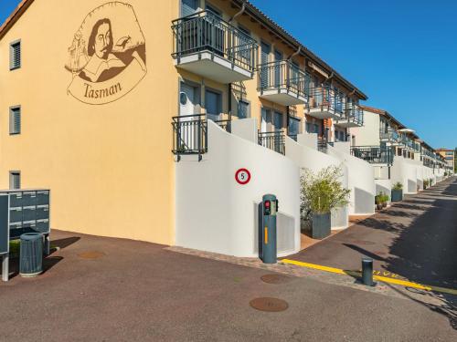 a building with a sign on the side of it at Apartment Tasman S16-R by Interhome in Bouveret