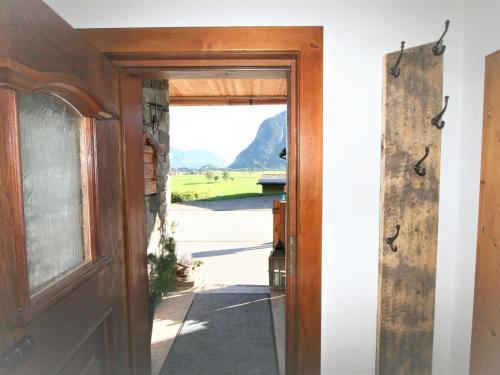 an open door with a view of a field at Apartment Chalet Astholz by Interhome in Strass