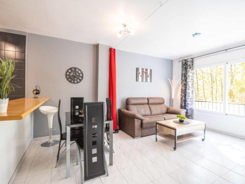 A seating area at Apartment Puigmal by Interhome