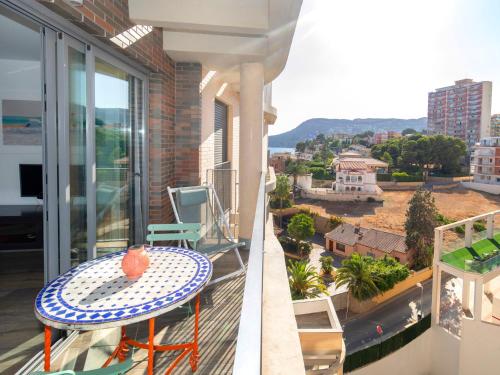 a balcony with a table and a view of a city at Apartment Isea Calpe-5 by Interhome in Calpe