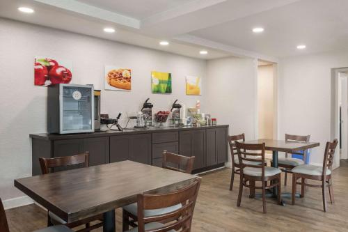 a waiting room with two tables and a counter at Quality Inn Gastonia East in Gastonia