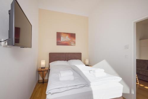 Кровать или кровати в номере Vienna Stay Apartments Pezzl 1170