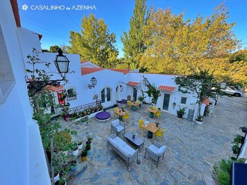 an aerial view of a patio with tables and chairs at Casalinho da Azenha - Charm House in Sintra