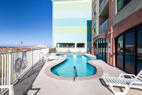 a swimming pool on the balcony of a building at Harbor Place 206 in Gulf Shores