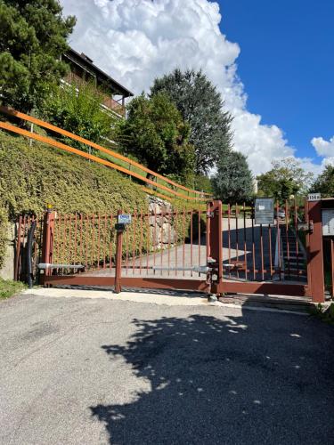 a gate on the side of a road at Appartamento Grigna2410 - Primaluna in Primaluna