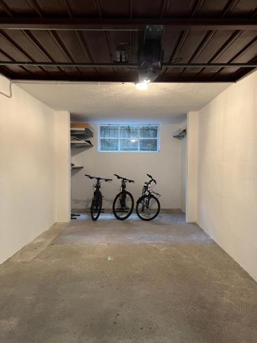 two bikes are parked in a garage at Appartamento Grigna2410 - Primaluna in Primaluna
