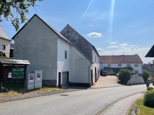 a white building on the side of a street at The Gantry in Drees