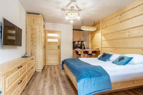 Ένα ή περισσότερα κρεβάτια σε δωμάτιο στο Apartamenty 58