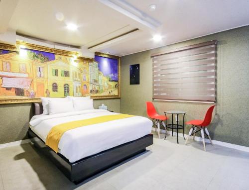 Postel nebo postele na pokoji v ubytování Opera Motel
