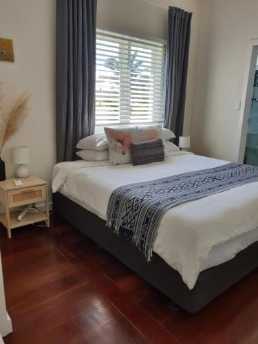 a bedroom with a large bed and a window at Retreat in Albany