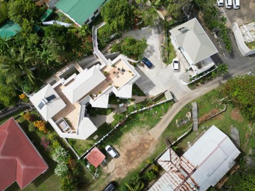 an overhead view of a house with a yard at Harmony Self-Catering Apartments in Beau Vallon